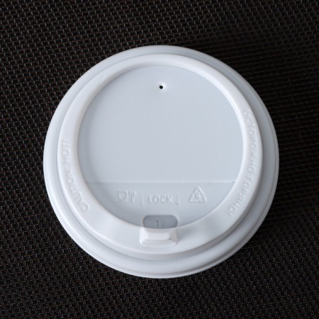 A plastic disposable lid for a white glass, with a valve, d = 9 cm-2