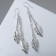 Earrings hanging "leaves" on chains, color silver, 7 cm