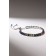 Bracelet with rhinestones "shine" on a puff, colored in silver