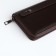 Men's purse-clate on a zipper, a department for bills, maps, coins, brown color