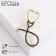 Brooch "Stetoscope", black color in gold