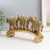 Polystone souvenir "Three elephants on the arc - exotic flowers" 27x5.5x13.5 cm