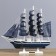 The ship souvenir medium "Kalev", the sides are blue with a white strip, the sails are blue, 30x7x32 cm