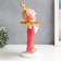 Souvenir Polystone stand "Baby with paper aircraft" pink 35x21x13 cm