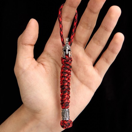 A keychain is a launcher for a spartan knife from a paracord, red, bead - silver
