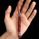 A keychain is a launcher for a spartan knife from a paracord, red, bead - silver