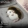 Brooch-Kulon "Hedgehog" Dreamer, white-pink color in black in gold