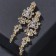 Clips "openwork" drops with curls, white color in gold