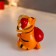 Piglite Polystone "Red Tigerick in a New Year's cap with gold in a bag" MIX 11x7x8.5 cm