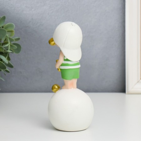 Polystone souvenir "Baby in a white baseball cap, with a gold bubble on a ball" 16x7x8 cm-1