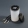 A capacity for cleaning and storing brushes, with holders and a lid, 200 ml, the color is transparent/black