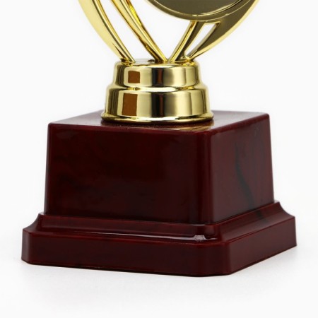 The award figure "Man with a star", gold, the plastic stand is red, 17 x 6.5 x 6.5 cm.-3