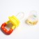Nibbler "Girafics", with silicone mesh, yellow/red color