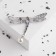 Brooch "Dragonfly" tail is mobile, the color is white-blue in silver