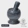 A mortar with an “marble” push, made of natural stone