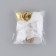 A bell on a pin with a bow for graduation, white, d = 2.6 cm