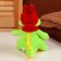 Soft toy "Dragon", in a red hat with ears, 15 cm, green color