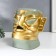 Souvenir Polystone Salvetnitsa "Aboriginal with a sharp nose" green-gold 19x12x20 cm