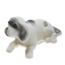Dog on a car panel shocking his head, small, white color