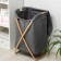 The basket is universal with a lid of the share "Lenon", 37 × 43 × 66 cm, the color is gray