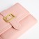 Women's wallet on the button, pink color