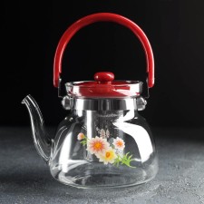 A glass teapot with a metal sieve 
