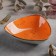 Ceramic triangular "constellation", 18 × 4.2 cm, orange color.
