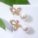 Earrings with pearls "butterfly" with bead, white color in gold