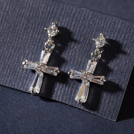 Earrings with rhinestones “Spark crosses” with a putty, white color in silver-1
