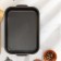 The baking sheet is rectangular, 19 × 25 cm, with a lid, anti -stick coating, blue color