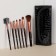A set of makeup brushes "Reptilia", 7 objects, a cover on a button, black color
