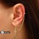Earr "Kaff" Two Crosses with a Circle, the color is white in gold