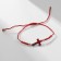 Bracelet-reinforcing "red thread" cross, red color