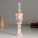 Polystone souvenir "Nutcracker in a pink uniform, with a gift" 4.5x4.5x21 cm