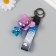 A plastic keychain with a carbine, a strap "Bear" holography 4x5.3x6.5 cm