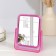 The mirror is desktop, bilateral, with an increase, a mirror surface 10.5 × 14 cm, color mix