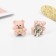 Clips children's "chosen" bear with a bow, pink color