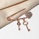 Pin "Heart" with keys, 5 cm, white color in pink gold