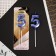 Candle for the cake, the number "5", blue.