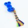 Chewing toy with a rope "Bone on a leash", 9.5 cm, blue