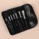 A set of makeup brushes, 7 items, a cover on a button, black color