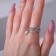The ring "chains" intertwined, the color is white in silver, dimensionless