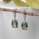Earrings with rhinestones "Illusion" Ovol voluminous, brown-green color in silver