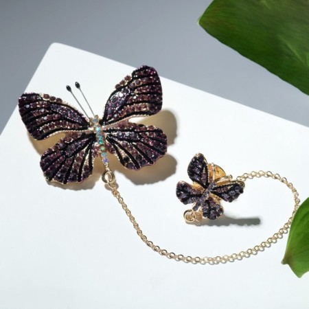 A brooch with an icon on the chain "Butterfly", the color is purple in gold-2