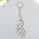 Metal keychain "Peacock" silver/gold 7.2x3 cm