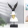Polystone souvenir "A man in a white hat with a black bird behind him" 48x23x19 cm