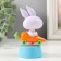 Plastic pendulum from the solar battery "White Bunny in the carrot machine" 5.8x6.5x10.5 cm