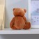 Soft toy "Bear with a bow", with hearts, color mix