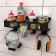 Holder for construction chemistry in banks, wall, with hooks, black