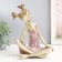 Polystone souvenir "Baby with two tails" gold with pink 21x13.5x26 cm